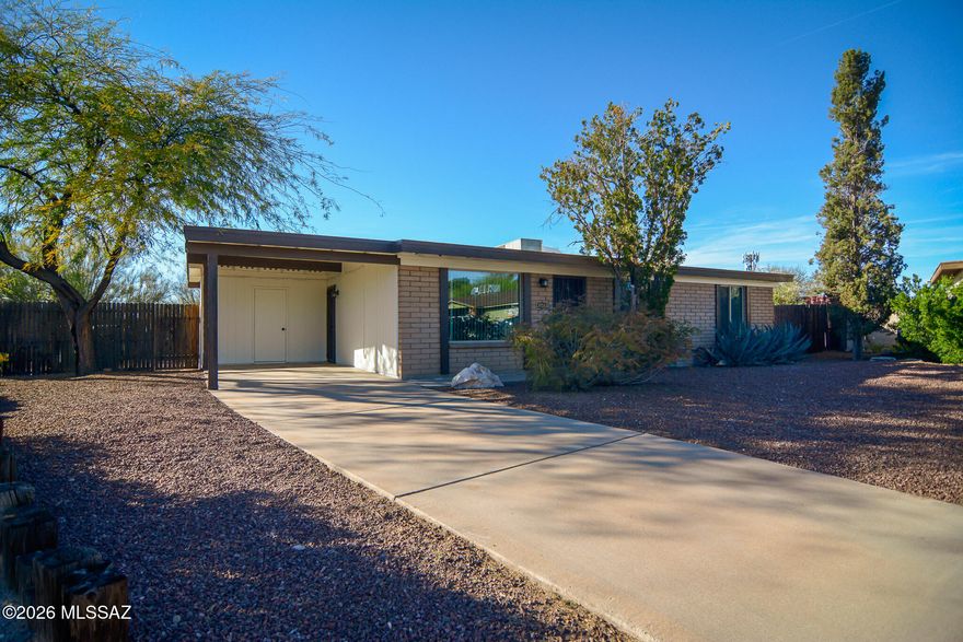 Beautifully remodeled Ranch style home. Located in a convenient Northwest Tucson location. Charming block construction. Rich wood look LVP flooring. Updated kitchen with stainless steel appliances. New custom interior and exterior paint. Updated bathrooms. Large fenced yard with sparking pool. Mature trees. Upgraded door hardware and light fixtures. New dual pane windows. New water heater and HVAC unit. One car carport. No HOA. This home shows beautifully.