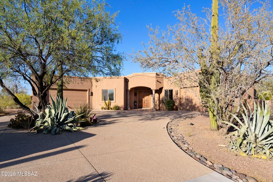 Nestled on 6.64 private acres in Oro Valley, this timeless Southwest-style estate offers stunning mountain views, exceptional privacy, & no street noise as the home sits well back from Lambert Lane. This spacious single-story, no-step home features 4 bedrooms, 4 bathrooms, plus an office w/ a thoughtfully designed split floor plan & expansive windows that fill the home w/ natural light. The chef's kitchen is designed for entertaining w/ a large island, double ovens, two sinks, a 6-burner stove, & an oversized walk-in pantry. The formal dining area is perfect for entertaining. Large primary suite offers private backyard access & a luxurious bath w/ a walk-in shower, soaking tub, & a large walk-in closet. Generously sized guest bedrooms include a Jack-&-Jill bath plus an additional en-suite. Tons of storage throughout. The resort-style backyard features a pool, spa, outdoor kitchen, & fireplace surrounded by stunning desert scenery. NO HOA. Included in the sale is the adjacent lot, bringing the total acreage to 6.64 acres. This one truly has it all!  Seller is licensed to sell real estate in Arizona.