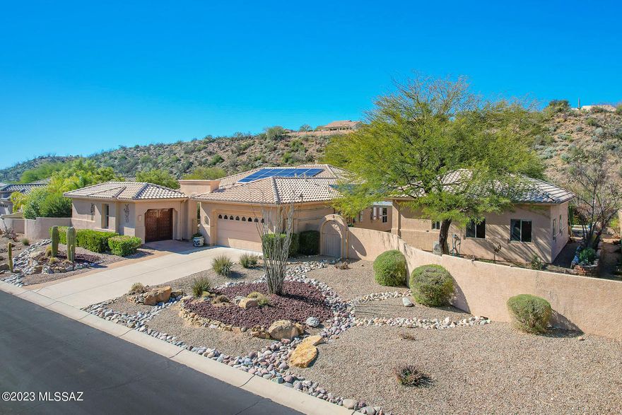 Situated on a 1 acre, resort-like lot with pool, hillside backdrop and front Catalina views. This spectacular retreat boasts a 2BD/3BA (3,161 sf) main home plus detached 1BD/1BA (434 sf) Casita and 1BD/1BA (704 sf) Casita w/workshop. Newer roof & leased solar on main home; newer HVAC. Enter the large main living space with tray ceiling, recessed in-wall fireplace, sunroom plus media room. Gourmet kitchen hosts center island and breakfast nook. Main bedrooms feature room-size closets and en-suite baths w/jetted tub & walk-in shower. Gated paver courtyard w/tiered fountain flows to large fire pit patio and trickling water feature. Paver walkway spans side & rear of home boasting lush desert plantings, fruit & shade trees, pool ramada w/bath and lap pool. SaddleBrooke Active Adult Community.