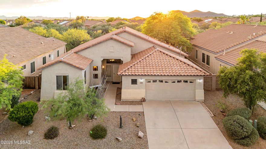 Set against the stunning desert landscape of Southwest Tucson, this well maintained home offers sweeping mountain views, peaceful surroundings, and a spacious open layout designed for comfortable everyday living. Located in a quiet neighborhood with easy access to outdoor recreation, the property captures the beauty of the Sonoran Desert from nearly every angle.
A private courtyard entry welcomes you into a bright interior filled with natural light, soaring ceilings, and expansive living spaces. The open concept design flows seamlessly between the living room, dining area, and kitchen, creating an inviting space for entertaining or relaxing at home. Wood look tile flooring throughout the main living areas adds warmth and durability, while large windows showcase the surrounding desert scenery and incredible Arizona sunsets.
The spacious primary suite features dual vanities, a soaking tub, walk in shower, and generous closet space. Additional bedrooms provide flexibility for guests, hobbies, or a home office.
Outside, the backyard is designed for low maintenance desert living with a covered patio, artificial turf, mature landscaping, and plenty of space to enjoy Tucson's beautiful evenings and mountain views. Whether enjoying a quiet morning coffee or gathering with friends at sunset, the outdoor spaces offer privacy and tranquility in a truly scenic setting.
This is an opportunity to enjoy spacious Southwest Tucson living with incredible natural beauty, a functional floorplan, and a setting that feels connected to the desert landscape.