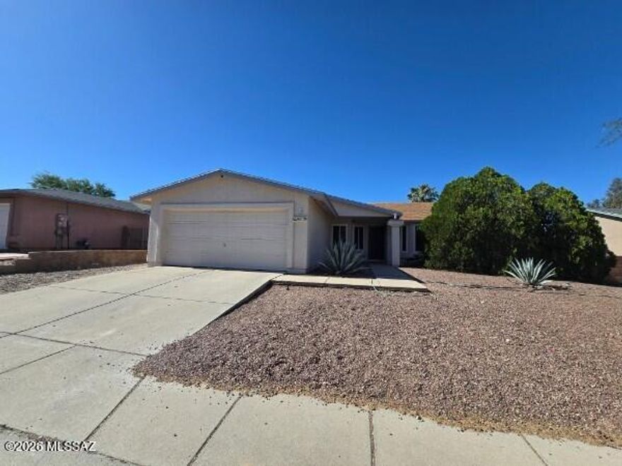 Updated 4BR/2BA home in desirable Sunset Pointe featuring a split bedroom floor plan, separate living and family rooms, and vaulted ceilings. Major improvements include replacement of original polybutylene plumbing, remodeled kitchen and bathrooms with granite countertops, tile flooring throughout, approximately 1,000 sq. ft. of artificial turf, and a roof replaced approximately 5 years ago. The open kitchen overlooks the family room and backyard, creating a comfortable space for everyday living and entertaining. Spacious primary suite offers dual vanities and garden tub. HVAC system is approximately 12 years old. Convenient Northwest Tucson location close to parks, schools, shopping, and dining.