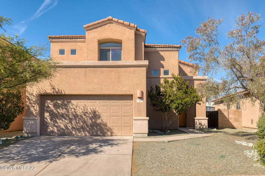 Discover this 2,080 sq. ft. AF Sterling home featuring 4 bedrooms and 3 bathrooms in a prime Tucson location. The interior welcomes you with soaring ceilings in the living room, creating an open and airy atmosphere that flows naturally into the kitchen and dining areas.
The versatile floor plan includes one full bedroom and bathroom on the main level, with three additional bedrooms upstairs--including a functional Jack-and-Jill bathroom. The upper-level bedrooms offer striking views of the surrounding mountains. Step outside to a private backyard oasis featuring a patio surrounded by roses, and fruit trees. Residents also enjoy access to a refreshing community pool.