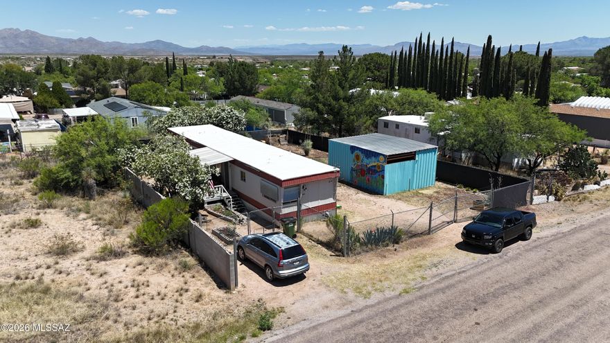 Charming mobile in Mescal offers comfortable living spaces, and a warm, welcoming feel. Thoughtful updates make it ideal for fulltime- living, or an investment opportunity. The detached workshop provides excellent space for hobbies, storage, projects, or equipment. Enjoy open skies, and plenty of room all while taking in the peaceful rural settng and beautiful mountain views.