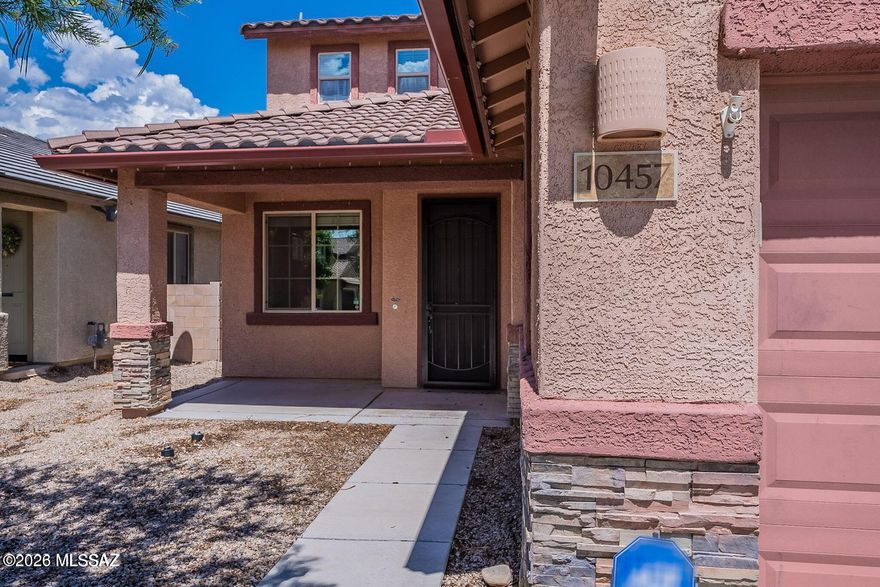 Tucked away at the end of a quiet cul-de-sac of The Rancho Del Lago community, this beautifully maintained two-story home in Vail offers the perfect blend of comfort, flexibility, and modern style.  Spacious 4-bedroom, 4-bath layout spans over 2,200 square feet and is designed for both everyday modern living and effortless entertaining. 

One of the standout features is the RARE NEXTGEN Model with private guest suite with its own separate entrance--complete with a bedroom, living space, and kitchenette. Whether you're hosting extended family, accommodating guests, or exploring rental potential, this space offers incredible versatility. 

Step inside to a bright, open-concept great room where natural light fills the space, creating a welcoming atmosphere you'll love coming home to. The kitchen seamlessly connects to the dining and living areas, making it easy to host gatherings or enjoy relaxed evenings in. 
With a thoughtful mix of tile and carpet flooring, plus year-round comfort from central air and heating, this home checks all the boxes.

Outside, the low-maintenance desert landscaping keeps things simple while still providing a peaceful setting. With no rear neighbors, the backyard is ideal for relaxing under the covered patio or taking in the surrounding mountain views--your own private retreat at the end of the day.

Additional highlights include a two-car garage, ample parking, and a well-kept community with low HOA fees. Enjoy access to community amenities, including a pool, playground, and basketball court. Plus, you're just minutes from highly rated schools, parks, and everything Vail has to offer.

This home truly combines space, function, and flexibility in a desirable location--ready for you to move in and make it your own.