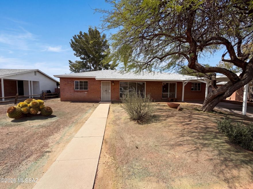 Discover 6611 E Julia St, recently enhanced with a partial flooring replacement throughout its functional layout. The kitchen is equipped with all stainless steel appliances. Beyond the interior, a covered patio overlooks the fenced in backyard, featuring a storage shed and  in ground pool. This updated home with ample outdoor features is a unique opportunity.. Included 100-Day Home Warranty with buyer activation