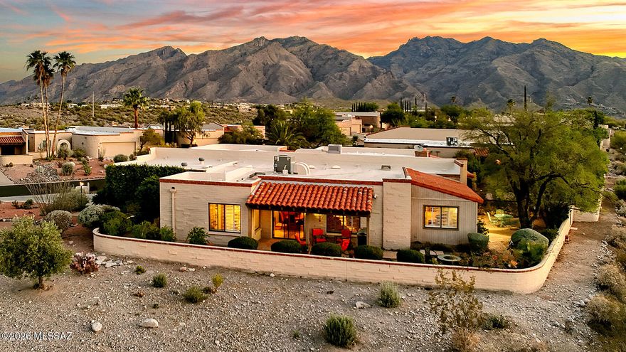 Perched high on a Ridgetop with adjacent open space within Fairfield's Sunrise Ridge-Catalina Foothills, this incredible single-story TH offers the ultimate in ideal desert living w/ sweeping panoramic views of the mountains and lush Sonoran desert by day&sparkling city lights by night. Home features a flowing split bedroom plan, multiple living areas all accessing wrap around outdoor patios The primary suite's cozy ambiance enjoys a remodeled ensuite bath w/separate shower. Secondary suite boasts artful remodeled bath w/glass bowel sink. Expansive windows&open living spaces maximize the extraordinary views, while the single-level layout creates ease of living&flow. An exceptional combination of location,design&comfort-this updated, well maintained home is as inspiring as its surroundings!