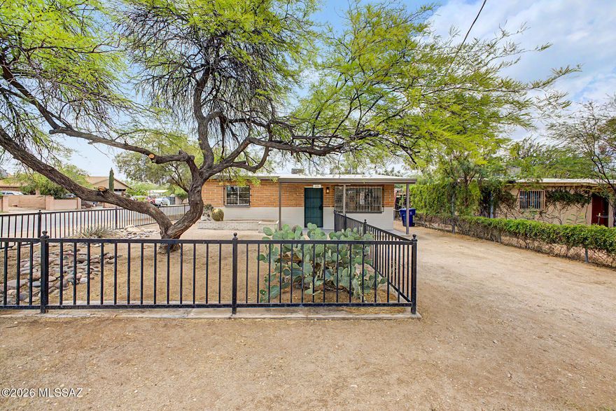 Now available!  Updated home in South Tucson. Beautiful features include modern electrical & plumbing fixtures, fresh interior & exterior paint, stainless steel appliances, new countertops, neutral brown cabinets and earth tone backsplash. Bathroom updated with Pedestal Sink, tile shower surrounds and fixtures. Large backyard and extended covered patio with lots of possibilities.  A must see!