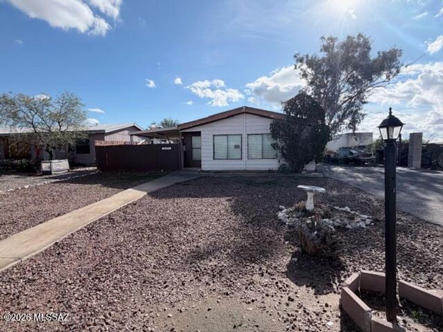 Great opportunity for sweat equity! This 2-bedroom, 2-bathroom home is located in the heart of Marana and features a split floor plan offering added privacy.  The property needs some fix-up, making it ideal for investors or buyers looking to customize and added value.