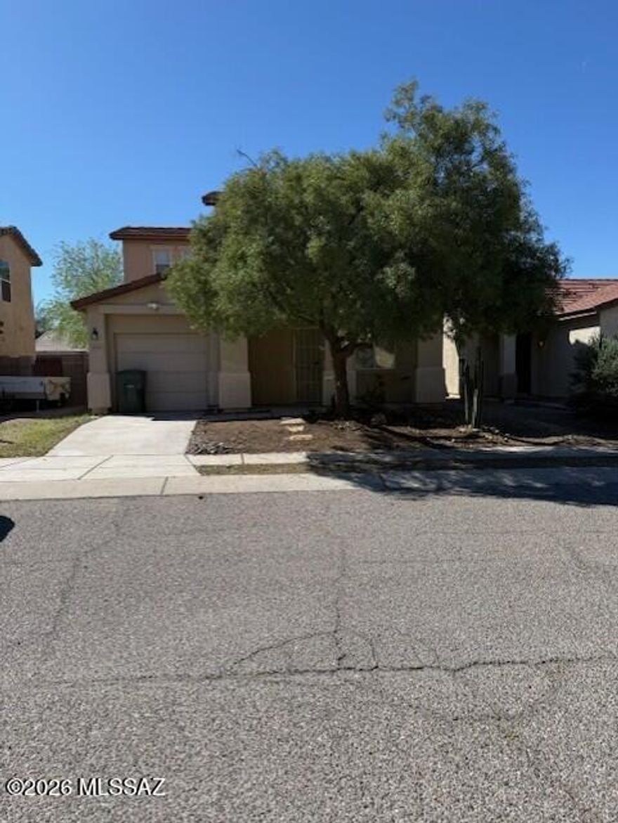 Home is a 3 bedroom, 2 bath, 2 story with a 1 car garage.  Home has the family room off the kitchen and access to the rear yard of the dining area.  Home has all applianes and is ready to move into with a little TLC.  Yard is low care with a drip system.  Home is in a good central location, convenient to Schools, U of A, shopping and the Loop.  The north south orientation, makes the backyard useable all year.  Due to condition, the property may have health/safety risk(s). Prior to entry / access, all parties must sign a Hold Harmless Agreement and the property may only  be shown by appointment.
