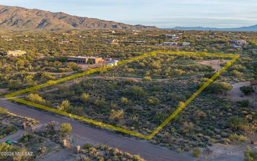 Gentle slope offering spectacular mountain views of both the Rincon Mountains and the Santa Catalina Mountains. The property features mature vegetation, including several beautiful saguaros, with a dirt driveway and building pad already in place. Paved road access leads directly to the lot, making it an easy and convenient build. Located in the highly regarded Tanque Verde Unified School District, known for its excellent schools. Just minutes from Saguaro National Park. A fantastic opportunity in a highly desirable area!
