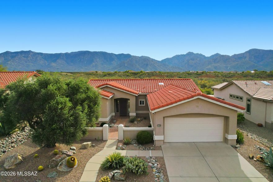 Stunning panoramic mountain views w/ no rear neighbors, this beautiful Sun City 55+ residence backs directly to open desert for unmatched privacy & serenity. High ceilings, skylights & warm wood flooring create an inviting, light filled interior. The kitchen has gorgeous abundant cabinets & granite counter tops. A versatile den w/ built in desk & its own exterior entrance is ideal for work or hobbies. The spacious primary suite features a double vanity, makeup counter and walk in closet w/ built in shelves. Enjoy low care desert landscaping, a covered patio with stunning mountain views  &  peaceful sunrise/sunset vista. The garage includes attached cabinets, overhead storage & utility sink. A rare blend of comfort, privacy & breathtaking natural beauty in a premier active-adult community.