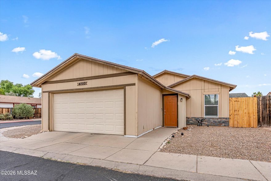 Welcome home to this beautiful 2-bedroom 2-bath corner-lot home in charming Edgebrooke Village. This home features a kitchen with plenty of space, stainless steel appliances, and an indoor laundry room for everyday convenience. Both bedrooms have new flooring, and the entire home is completely carpet-free. The primary bedroom features a walk-in closet, double vanity, and tiled walk-in shower. Step outside to your expansive backyard, where new fences provide a private retreat for weekend BBQs under the covered patio. Parking is a breeze with a 2-car garage plus a rare, dedicated side space large enough for a full-sized truck! New windows installed throughout and the roof is just over 3 years old. Enjoy a prime location within walking distance to the community park and pool, and just minutes from I-10, Tucson Mall, schools, and essential medical and shopping hubs. Come and see it today!