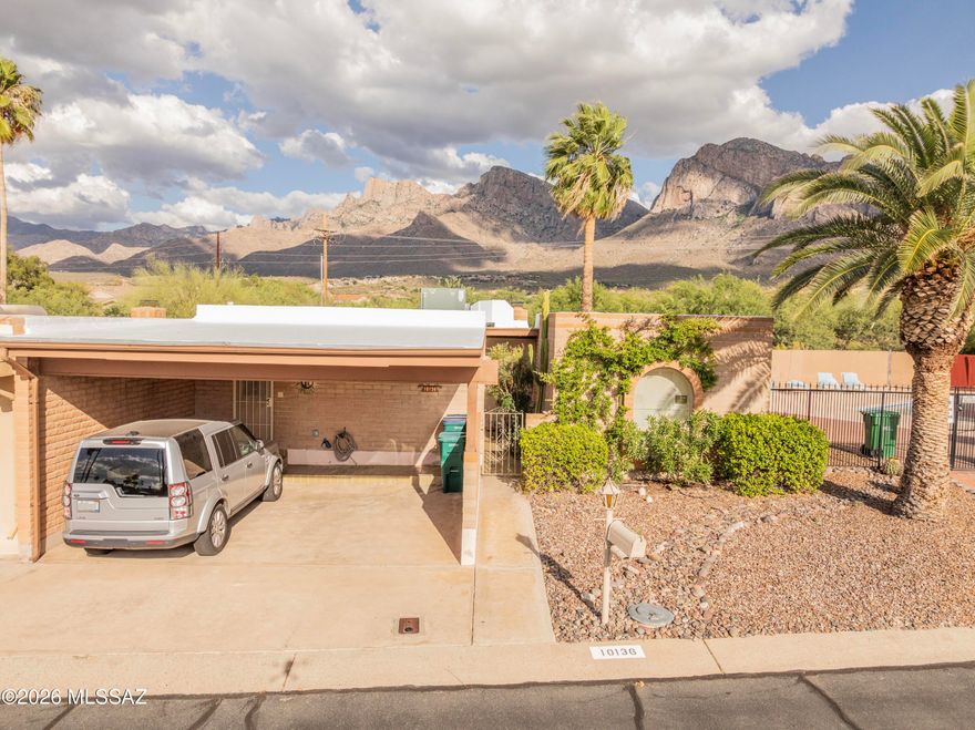 Views, location, and easy one-story living -- this Oro Valley townhouse has all three.  PLUS it's turnkey. 🗝️

Enjoy Oro Valley living with views of Pusch Ridge and the Catalina Mountains from this well-maintained one-story townhouse. This spacious 2-bedroom, 2-bath home offers solid masonry construction, a larger living area with beehive fireplace & rigid vinyl wood flooring.  Kitchen with casual dining space. Roof replaced in 2024.  No pop-corn ceilings. The east-facing back patio has no neighbors directly behind, flower beds, drip system, and beautiful mountain views. Located next to heated year-round pool, with the clubhouse nearby. Two-car carport. Adjacent to Oro Valley Country Club. Convenient to shopping, dining, entertainment, hiking, and The Chuck Huckelberry Loo What does NOT convey:  three off white recliners in Living room, the small wooden end table between the recliners, and the two bicycles in the storage unit. Of course all personal items do not convey.