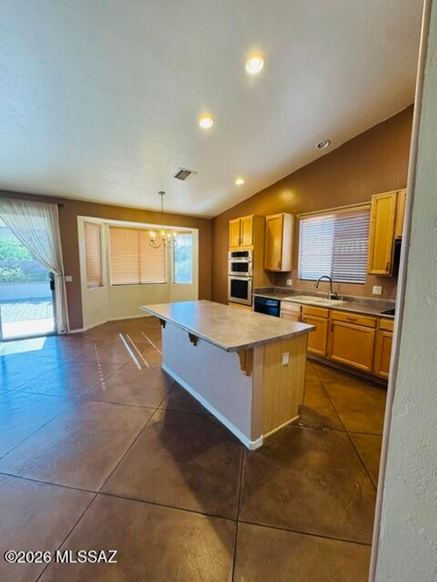 Beautiful Oro Valley Home in Desirable Monterra Knolls

Welcome home to this spacious and well-maintained 4-bedroom, 2-bathroom home located in the highly sought-after Monterra Knolls community in Oro Valley. Featuring an open great-room floor plan, vaulted ceilings, and abundant natural light, this home offers both comfort and functionality for everyday living.

The thoughtfully designed layout includes a bright kitchen with ample cabinet space, a pantry, and a seamless flow into the dining and living areas; perfect for entertaining or relaxing at home. The split-bedroom floor plan provides added privacy, while the spacious primary suite features a walk-in closet and ensuite bath. Additional highlights include:
Approx. 1,868 sq ft
4 bedrooms / 2 bathrooms
3-car garage
Central A/C
Low-maintenance desert landscaping
Covered patio and private backyard
Convenient access to shopping, restaurants, parks, and top-rated schools

Enjoy everything Oro Valley has to offer, including nearby hiking trails, mountain views, and easy access to Tucson while living in a quiet, established neighborhood.

Call (520) 328-8220 or fill out guest card through website at jmdamanagement.com to set up a tour! Equal Housing Opportunity.