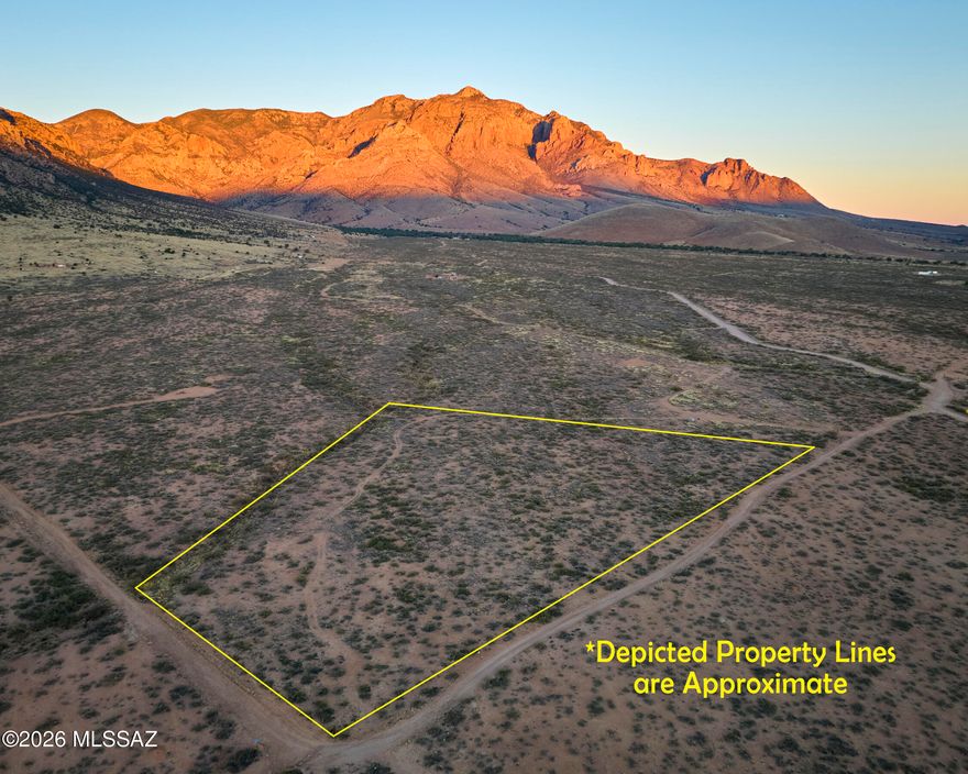 Enjoy expansive views of mountain bluffs and the San Simon Valley from this private 7-acre parcel in Portal, AZ. Multiple cleared, buildable homesites with established drive and walk paths make this property ready for your future plans. Protected from grazing for over 30 years, allowing native grasses and mesquite to thrive. Quick access to National Forest and State Trust Land for horseback riding, hunting, and hiking--ideal for outdoor recreation. No deed restrictions and no HOA offer flexibility for a custom build, off-grid living, or investment. Seller to pay for survey. Buyer to fence north boundary within 6 months of COE.  Call today!