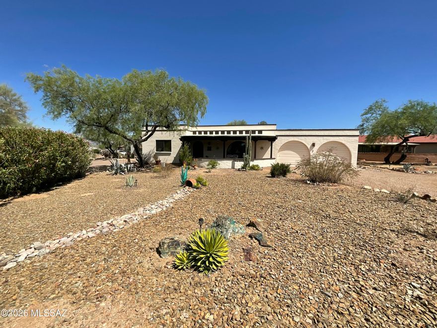 Unique La Canada Desert home in 55+ Active Retired community. Welcome to this relaxing garden backyard with water feature, custom wall mural, comfortable lounge area and a view of mountains. Oscar may stop by for breakfast, the resident lizard. Evenings can bring the surrounding migratory creatures.  Classic front veranda welcome you in and keep you cool on the warm days. Custom is a pleasant word in this home. From the fireplace to the mural outback. Owned solar and use of mini splits keep you very comfortable throughout at a fraction of the cost. Are you a hobbiest or have Social Media webcast needs? The perfect area is off the Arizona Room. Comfortable bedrooms and well appointed baths round out this well maintained home.  Most furniture included. See pics.