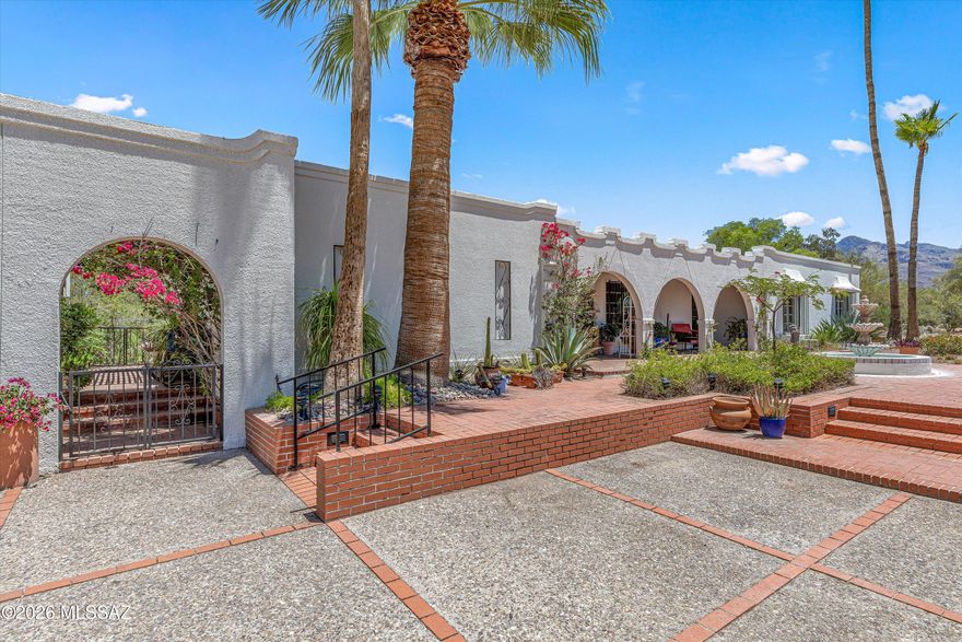 Welcome to a true Casas Adobes classic. Built in 1967, this authentic territorial-style home blends timeless Southwest architecture with modern updates in one of Tucson's most sought-after neighborhoods. Features include iconic arched architecture, original wood beam ceilings, restored concrete floors, mountain views, expansive brick patios, and beautifully landscaped desert courtyards with mature cactus gardens, bougainvillea, fountains, and shaded outdoor living spaces. 

No HOA. Located in a wonderful family-friendly neighborhood within walking distance to Tohono Chul, Harelson and Cross schools, churches, a community pool, and Casas Adobes Plaza.

This iconic Old Pueblo home won't last long!
