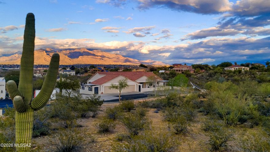 Beautiful West side home that won't disappoint! Walk into the open Great room w/ gorgeous new kitchen: new cabinets, GE Profile stainless steel appliances, undermount lighting, walk-in pantry and oversized island with seating & granite countertops. The back yard is like your own private resort with mountain views, city views, 2020 pool, built in BBQ, turf and full length covered patio. This home has a 4 car attached garage with new doors plus an oversized detached 2 car garage; perfect for all your toys, hobbies and vehicles. Updated solar provides you with a minimal electric bill. Not only does this home have 4 bedrooms, it has a den & flex room, perfect for home offices, guests, family, gaming or crafts! Primary bedroom has separate access to the backyard, walk-in closet and lovely bath. Bathroom has garden tub, separate shower, separate vanities, a private commode and linen closet. Upgrades include new flooring, new HVAC units, new water heater, water filtration, ceiling fans & lights, and updated hall bath. HOA is a self governed road maintenance agreement. Same freedom as a home with no HOA but private neighborhood with secure gate. This home is surrounded by Sonoran Desert; trails, arroyo and nature AND you can still be downtown in 15 mins!