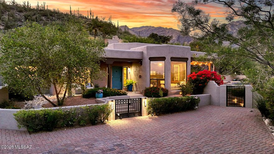 That rare home that is the perfect blend of inviting, perfectly designed, (think 360 views at every turn!) and most importantly a casual elegance throughout. The feeling of inside/outside living exemplifies the outdoor lifestyle with an abundance of patios, pool and spa, and even an area of turf.  Keep in mind that all of this is framed by amazing views of the mountains and even the city lights. Nestled up on a cul-de-sac in the heart of the foothills sits this find .  Flexibility?  The 5th bedroom (with french doors) is also amazing for an office or den.  The 3 car garage with electric car charger provides both room and storage.  I have been doing this for 30 years and when a home comes around that embraces what Tucson is all about, trust me and go see it.