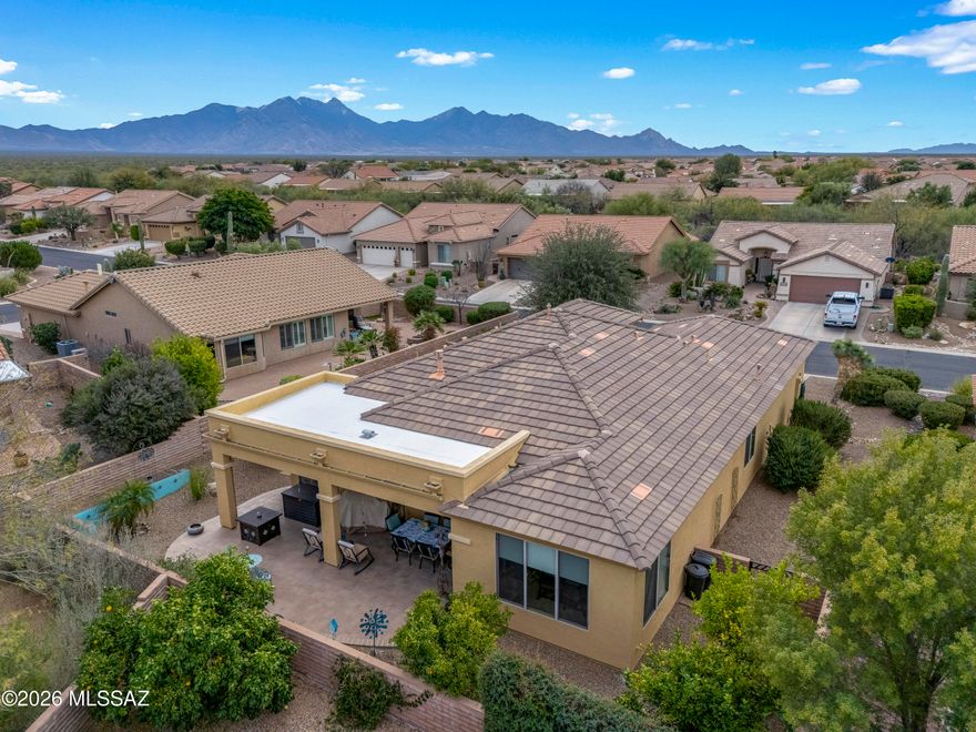 Recently repositioned, this desirable Fiesta floorplan now represents one of the stronger opportunities currently available in Quail Creek. Two true private bedroom suites offer flexibility for guests or shared living while still maintaining everyday comfort and independence. A spacious great room, extended north-facing patio, and tandem garage create a layout designed for both relaxed daily living and entertaining.

Located within the active adult community of Quail Creek, this thoughtfully designed home offers a balance of open living space and defined areas that many buyers find comfortable and functional. The great room features a custom media wall with a fireplace and flows easily into the kitchen, where quartz countertops, a gas range, an island workspace, and generous cabinetry support both casual meals and hosting.

One of the most sought-after features of this Fiesta model is the dual-suite configuration. Each bedroom offers privacy and its own bathroom access, making the home well-suited for visiting family, long-term guests, or evolving lifestyle needs.

A separate den provides valuable flexibility and can function as a home office, hobby space, reading room, or additional lounge area. The extended north-facing covered patio enhances year-round outdoor living, offering shade and usability during warmer months while still allowing enjoyment of Arizona's outdoor lifestyle.

The 2 1/2-car tandem garage provides practical storage capacity and space for projects, golf cart parking, or organized utility use.

Quail Creek residents enjoy access to golf, fitness facilities, dining, clubs, and a vibrant social calendar within a gated resort-style setting. With recent pricing adjustments and a desirable floorplan, this home presents a compelling