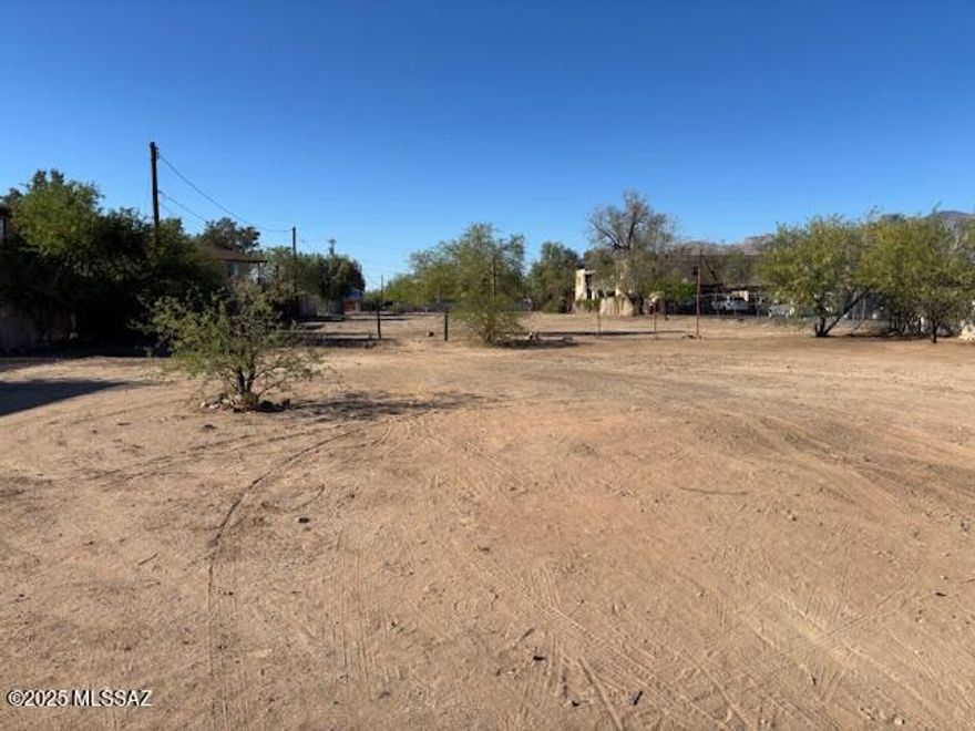 Rare three-parcel assemblage offering multifamily development potential for up to 34 residential units in central Tucson. The offering includes 245, 263, and 265 E Mohave St, creating a larger development footprint for investors and developers seeking higher-density housing in a growing rental market. The property currently includes a main residence, casita, and multiple storage units, which may provide interim income while development plans are finalized. Centrally located with convenient access to I-10, Downtown Tucson, the University of Arizona, and major employment centers, the site benefits from strong long-term rental demand drivers. Development opportunities with this level of density potential and central location are increasingly rare. Ideal for developers planning a multifamily project, build-to-rent community, or redevelopment opportunity. Buyer to verify zoning, development potential, and utilities.