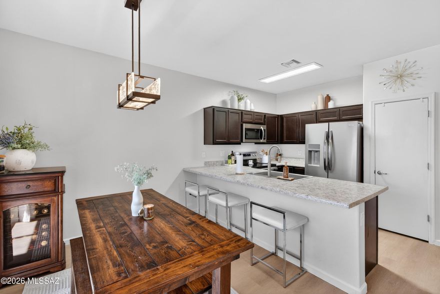 Built in 2020, this light-filled 3 bedroom, 2 bath home in the gated community of Vista Montana Estates delivers modern living with privacy and efficiency. The open layout features upgraded flooring, stainless steel appliances, updated fixtures and lighting, ceiling fans in every room, and an extended primary closet. Solar panels helps keep utility costs down. The finished backyard offers pavers, artificial turf, enhanced privacy fencing, and no rear neighbors--just open desert views and stunning sunsets. Ideal for first-time buyers, busy professionals seeking lock-and-leave convenience, or Raytheon and DMAFB relocation. Community pool, spa, basketball court and clubhouse. Quick access to I-10, major employers, and Tucson International Airport.