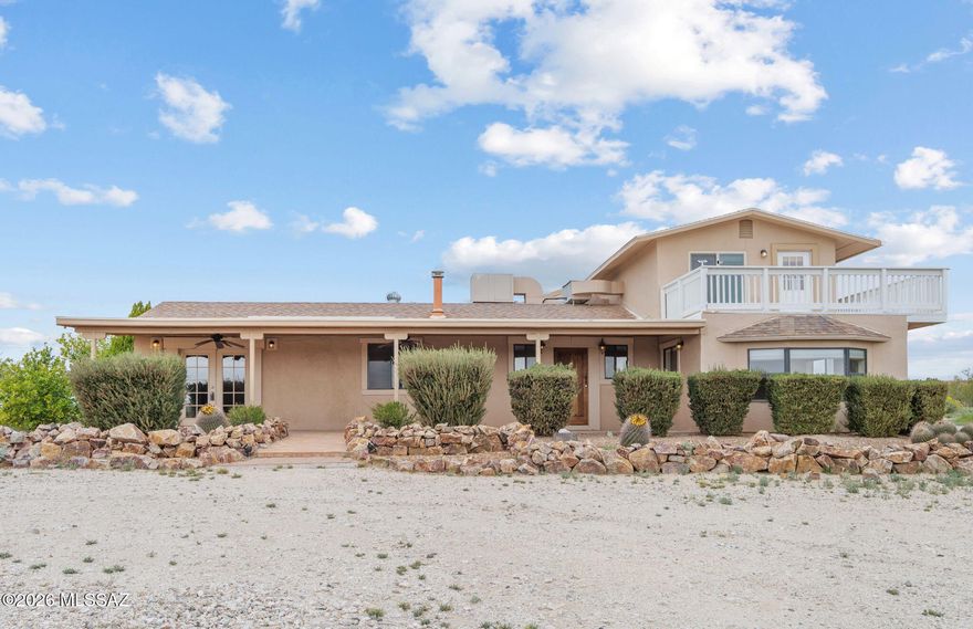 Perched on an elevated 4.97-acre lot with sweeping mountain views, this 2,340 sq ft, 3-bedroom, 2-bath property offers space, privacy, and endless potential. The home features a functional layout ready for a new owner to personalize, update, and truly make their own. Ideal for those seeking room to spread out, the property includes a private well, expansive 5-car garage, and a dedicated workshop--perfect for hobbyists, car enthusiasts, or extra storage. With horse privileges and wide-open land, this is a rare opportunity to create your own desert retreat while enjoying the peace and beauty of Southern Arizona. Whether you envision a modern renovation or a custom ranch escape, this property provides the foundation to bring your vision to life.