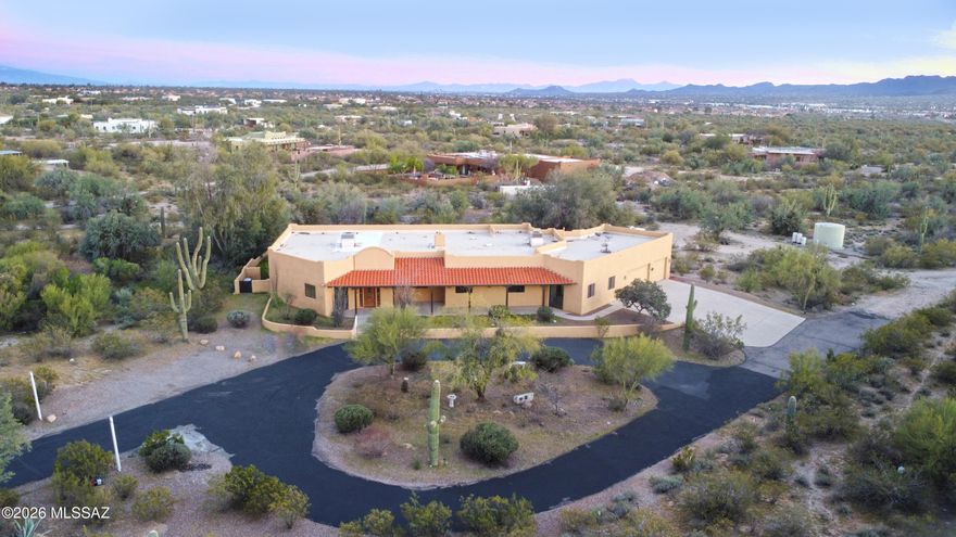 Panoramic mountain views, enormous lot, ample living space, no HOA! Situated on 3.5 acres, this rural feeling property is surprisingly close to many shopping areas. The home features 4 bedrooms, PLUS 3 bonus rooms you can convert to a number of spaces-ideal for additional bedrooms, game room, office, home gym or a home theater. The spacious great room has a gourmet kitchen with granite countertops, hickory cabinets, a large island with prep sink, 5-burner gas range, & abundant storage. Architectural details include wood vigas, skylights, rounded entries, wood doors, tall ceilings, and a beehive-style gas fireplace. The backyard offers a heated pool+spa, outdoor kitchen, & covered (screened-in) patio. If the 3-car garage isn't enough, there's plenty of space out back for addit'l parking.