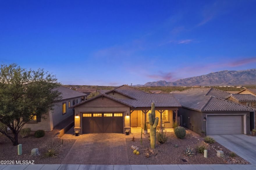 Gorgeous Pulte home with views of the Catalina Mountains. This Luxury home includes 3 bedrooms, 2 bathrooms, den/office and 2,045 sq ft. Two car garage with an extended bay to be used as shop or extra storage. The interior has everything perfectly in place and upgraded. Gourmet kitchen with large center island,  granite countertops, custom lighting, stainless steel appliances, water softener, and bar counter. Primary bedroom with window seat, low threshold glass walk-in shower, dual sinks & walk-in closet. The grandeur extends outdoors with a picturese backyard featuring a large covered patio, fire pit, artificial grass, pavers, lights & jacuzzi brand hot tub perfect for hosting unforgettable gatherings. Many upgrades and extras: surround sound in living room and patio, backyard Malibu lighting, barn door on office, garage rack system amd much more. The Rancho Vistoso Valley Vista community is an all-single-story subdivision, showcasing Contemporary Architectural Designs. Close to Restaurants, Schools, Shopping, Medical Care. This is a must-see property!