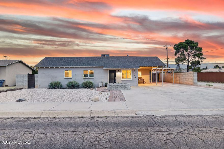 Beautifully updated and centrally located, this move in ready home blends modern design with comfort, functionality, and Arizona outdoor living. From the moment you arrive, the freshly painted exterior, expansive driveway, and gated covered parking create impressive curb appeal with plenty of room for guests, toys, or multi vehicle parking.
Inside, you are welcomed by an open concept layout filled with natural light, wood look tile flooring, recessed lighting, and stylish finishes throughout. The remodeled kitchen serves as the heart of the home, featuring quartz countertops, shaker cabinetry, stainless steel appliances, custom backsplash, oversized breakfast bar seating, and designer industrial inspired lighting that adds warmth and character.

The spacious living and dining areas flow seamlessly for both everyday living and entertaining, while the generously sized primary suite offers a peaceful retreat with additional flex space ideal for a sitting area, office, nursery, or workout space. Updated bathrooms showcase modern vanities, upgraded fixtures, and clean contemporary finishes.

Step outside to your private backyard oasis complete with low maintenance landscaping, artificial turf, covered patio seating, and plenty of space to relax, entertain, or enjoy Tucson sunsets year round. The fully walled yard offers both privacy and functionality with additional gated access and storage potential.

Conveniently located near shopping, dining, schools, parks, and major commuting routes, this thoughtfully updated home delivers the perfect combination of style, comfort, and central Tucson convenience.

Schedule your private showing today and come see everything this beautifully updated home has to offer.