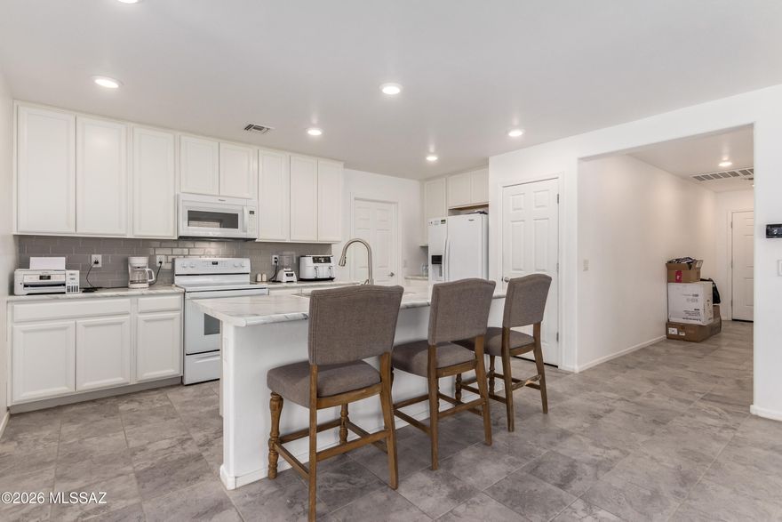 **Price improvement of $15,000**
Nestled at the end of a peaceful cul-de-sac in sought-after Southwest Tucson, 8569 W Amazilia Place blends modern comfort with easy desert living. Built in 2018 and thoughtfully updated with fresh interior paint as well as updated flooring this year, this beautifully maintained home offers an inviting open-concept layout designed for both relaxing and entertaining. The spacious kitchen features abundant cabinetry, generous counter space, and effortless flow into the dining and living areas, creating the perfect gathering space for family and friends.

The private primary suite offers a serene retreat with a walk-in closet and en-suite bath, while the additional bedrooms provide flexibility for guests, hobbies, or a home office. Step outside to a large, low-maintenance backyard with desert landscaping, a fully walled yard, and no neighbors behind--offering extra privacy and peaceful Arizona sunsets.

Ideally positioned with desirable North/South exposure, this home is tucked within a quiet neighborhood while still being just minutes from shopping, dining, parks, schools, and freeway access. Whether you're searching for your first home, a seasonal retreat, or the perfect place to downsize, this move-in-ready gem delivers comfort, convenience, and the best of Tucson living.