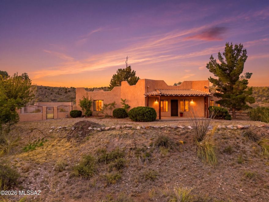 The home has a covered patio and sits on a hilltop with a private backyard for your own personal desert retreat.. Set on 4.78 acres, plus an OVERSIZED 2-car garage/workshop. A covered concrete pad for your camper, boat or UTV. Step inside to a split floor plan with plenty of natural lighting. The living room and kitchen are facing the mountain range showcasing the beautiful Arizona desert sunset. Kitchen has newer appliances, generous counter space and ample cabinetry. The primary suite, boasts a walk-in closet, dual sink vanity, and a tile shower. This property is ideal for anyone seeking room to live, create and enjoy life on their own terms with a great outdoor living space, this home is ready to welcome you!