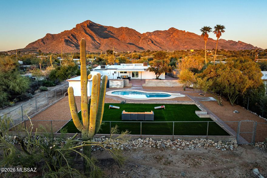 Breathtaking Catalina Mountain Views on a Flat, Usable Acre -- No HOA!
Located in one of the most desirable areas of Tucson -- the west side of the Catalina Foothills and southern point of Oro Valley -- this beautifully remodeled property offers 2555 sq. ft. in the main home plus an additional ~300 sq. ft. heated and cooled flex space by the pool. Perfect for a gym, theater, game room, workshop, or studio!
Designed with a functional split floorplan, the home features two spacious living areas, 4 bedrooms, and 3 full bathrooms -- including a luxurious primary suite with a 10-foot walk-in shower (dual shower heads), separate vanities, smart bidet toilet, and a generous walk-in closet. A second ensuite bedroom provides ideal guest or multigenerational living. The stunning chef's kitchen showcases custom soft-close cabinetry, built-in pantry, roll-out garbage cabinet, tray storage, quartz countertops, and an oversized island with seating for six and storage on both sides. LG stainless steel appliances include a side-by-side refrigerator with water/ice, built-in double ovens, 5-burner cooktop, dishwasher, and built-in microwave.

Beautiful ceramic tile flows throughout the home, complemented by recessed lighting, new doors, baseboards, hardware, drywall, texture, and paint.

Additional highlights:
" Two brand-new HVAC systems
" Roof recently sealed with two protective coats
" Walk-in laundry room with floor-to-ceiling cabinetry, undermount sink & quartz counters
" Fireplace
" Three storage sheds

Step outside to a true backyard oasis featuring brick paver patios and walkways, planters, artificial turf, a covered patio, and a beautifully refinished diving pool. The flat acre extends well beyond the pool area -- offering incredible flexibility for expansion.

Enjoy morning coffee in the private front courtyard with panoramic Catalina Mountain views. Situated on a quiet cul-de-sac street with an optional HOA for only $20 a year -- bring your toys, RV, boat, trailer etc.

Minutes from golf, hiking, biking, resorts, restaurants, shopping, hospitals, and an easy commute to downtown Tucson, the University of Arizona, and I-10.