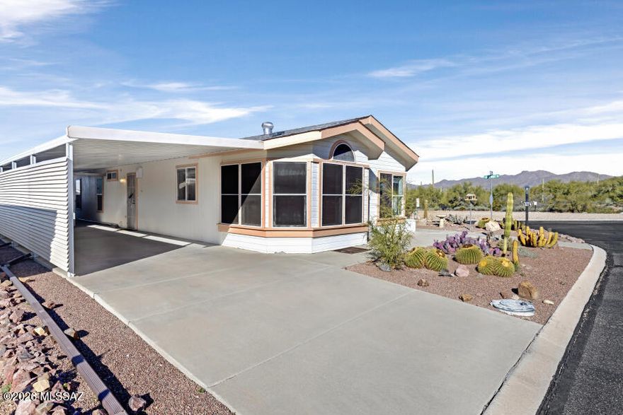 Views! Views! Views!
Enjoy the panoramic views of the Sonoran Desert, including saguaro forests of Tucson Mountain Park, all from this corner-lot home with no buildable lot to the north—your views are protected! This well-maintained 2006 Hallmark home offers two bedrooms plus a versatile third room ideal for an office, den, or craft space.
Relax in the screened room featuring epoxy-coated concrete floors while taking in the stunning northern views. The updated kitchen boasts granite countertops and newer appliances and opens seamlessly to the dining area and living room, perfect for both everyday living and entertaining. Wood laminate flooring throughout most of the home.
Additional features include a spacious workshop/storage shed located under the carport and a private hot tub tucked behind it for ultimate relaxation. Multiple hiking trails and trailhead located right across the street.
Located in Copper Crest, a gated Active Adult Community, residents enjoy resort-style amenities including swimming pool, spa, shuffleboard, pool table, fitness center, hiking and biking trails, and moreall just a short drive from Tucson.
Best of all,you own the land!