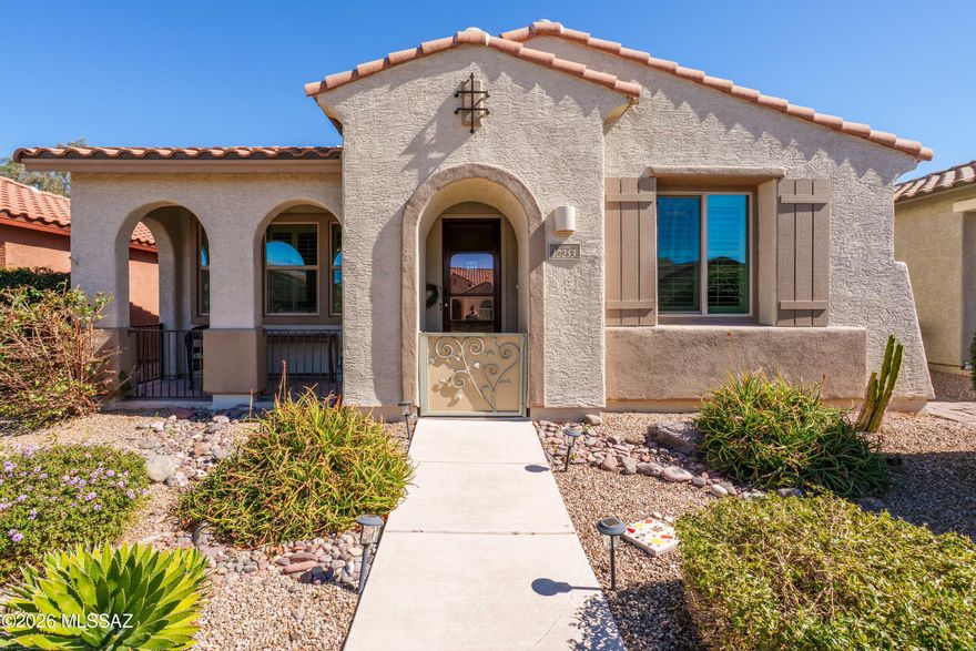 This one is special! A front patio invites you into the custom doors as you enter an immaculate home with virtually every upgrade you can imagine with an extra den/office/guest quarters, plantation shutters, custom tilework, built-in bookcase, ceiling sound system, island kitchen, granite countertops, lots of extra cabinetry, only the best appliances: LG fridge, double ovens, W/D included. Private courtyard, altrium patio, with custom brick pavers. Amazing master with high clerestory windows, high quality shelving, cabinets and drawers added in walk-in!