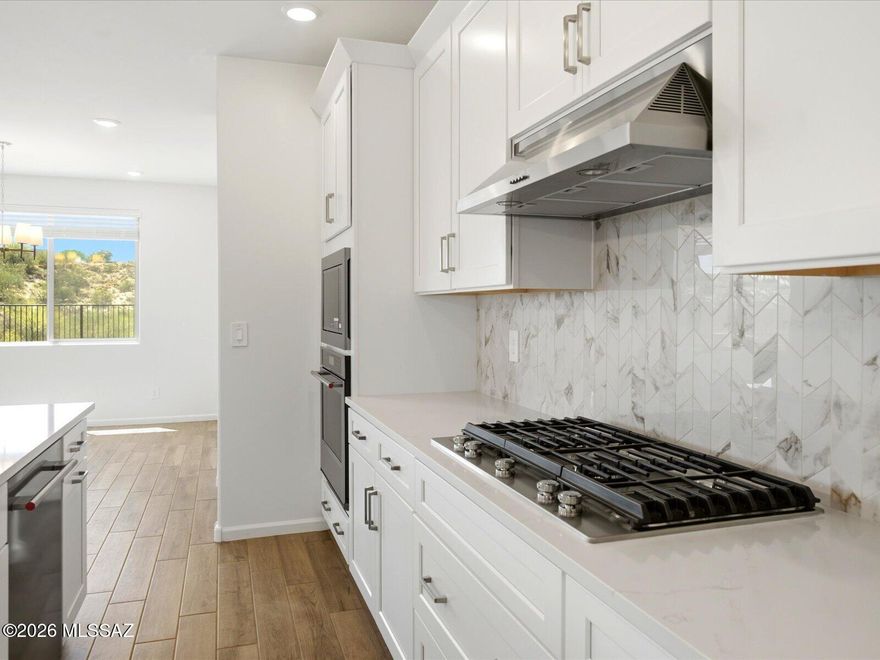Oro Valley. Energy Efficient. Move in Ready.

The Ruby floorplan features a 3-car tandem garage and a charming front porch, offering both style and functionality. This 4-bedroom, 2.5-bath home showcases an expansive great room perfect for entertaining, along with a private primary suite for a relaxing retreat.
Now selling in Oro Valley, Naranja Trails is a gated community with homes starting in the low $600s, offering scenic walking trails and a prime location just across from beautiful Naranja Park. Every home is built with innovative, energy-efficient features designed to enhance comfort, health, and long-term savings.