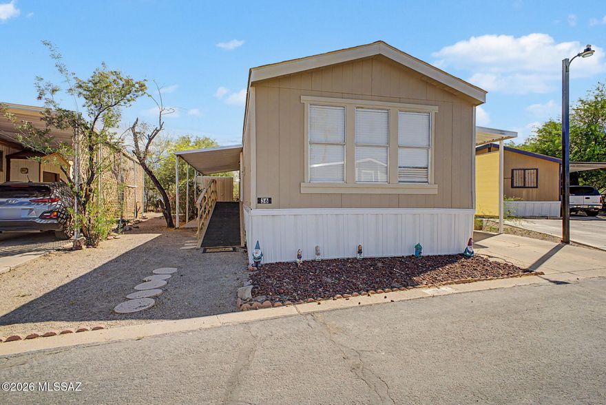 Spacious and thoughtfully upgraded, this move-in-ready home offers comfort, efficiency, and accessibility. Designed to accommodate a variety of needs, it features both ramp and stair access. The home includes a desirable walk-in closet, all new appliances, and a beautifully remodeled hall bathroom. Interior upgrades continue with wooden blinds on all windows, new ceiling fans, and newly installed baseboards for a clean, modern feel. Enjoy energy efficiency and year-round comfort with Mitsubishi mini-split systems and solar screens on the windows. Safety and peace of mind come with carbon monoxide and smoke alarms, along with a newly installed security door. Outside, you'll find covered patio areas perfect for relaxing or entertaining, a new roof, and a new storage shed for added convenience.

Located in a land lease community, residents enjoy a variety of amenities designed for comfortable, easy living. Centrally situated near the freeway, this home offers quick access to downtown and is just minutes from nearby mountain views and outdoor recreation. A well-rounded property that blends thoughtful updates with everyday functionality.