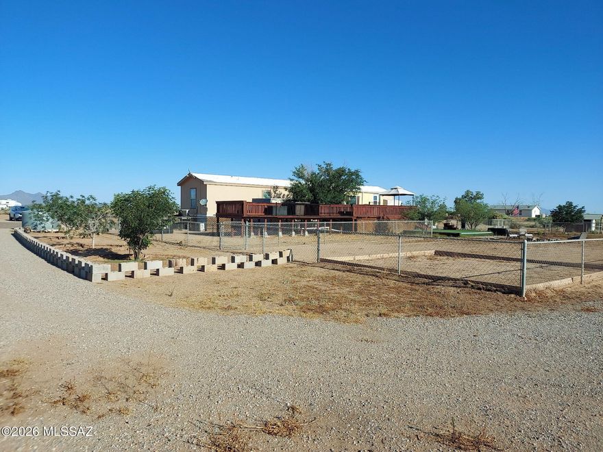 Investor Dream!! Private Registered Well with 3 electric pedestal, 3 septic tanks already installed, and RV hook ups NOTE: Seller is willing sell 20 acres separately of flat usable land for $199,000, which is subdividable. The 20 acres has electric, septic, water, and ready for your new home.  Please contact Listing Agent. Imagine owning your own Ranch or Homestead. This expansive 40 subdividable flat usable acreage has it all with panoramic mountain views and stunning sunrises and sunsets.  Ideal for animal lovers, hobby ranchers or anyone wanting to build the dream home/ranch. The home offers 3 bedrooms, 2 full bathrooms, and a sunroom with its own ice maker overlooking the natural landscape. The open living area features a modern electric fireplace, adding warmth and ambiance. The spacious primary suite includes a soaking tub and separate shower.  Buyer to verify all information.