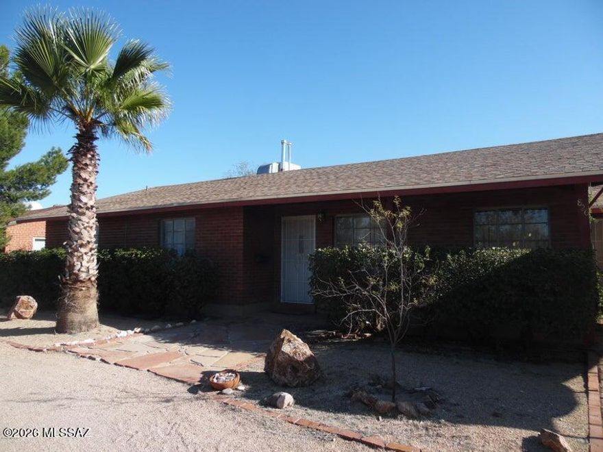 Fantastic red brick home centrally located and close to everything. This home is 4 bedrooms and 2 baths with tile throughout except 3 bedrooms. One room has its own private entrance and is a perfect office or mother in law quarters. This home has a large great room and open kitchen. Enjoy your huge backyard and covered patio. Circle drive and one covered parking. New AC. This home is seconds to 3rd street bike path, close to a park and minutes from the U of A and University Medical center. Shopping, restaurants and entertainment just minutes away. Call today for a tour.