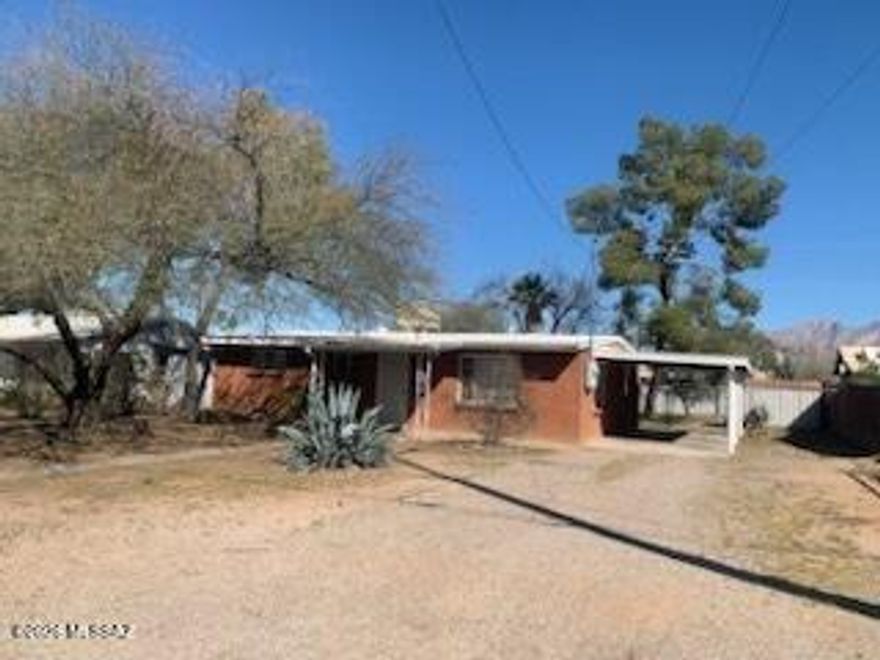 Cute 3BR/1.5BA house with R-2 zoning on nearly a quarter of an acre in the middle of Tucson. If you enjoy spending time outside in your large backyard with mature landscaping, this place is ready for you to call it home. This adorable brick home comes with painted concrete floors throughout. Enjoy the eat in kitchen as you look out your back door into your private oasis of a yard. Plenty of space to park your toys! 20 minute drive to I-10 so your morning commute will be a breeze. Dont miss out on this steal of a home!