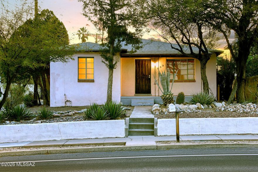 Adorable Sam Hughes 2-bedroom, 1-bath home full of historic charm and ready for thoughtful renovation. Original hardwood floors, a vintage kitchen with classic tile and cabinetry, and a charming retro bathroom preserve the home's authentic character. Spacious bedrooms and a huge backyard offer endless potential for expansion, gardens, or outdoor living. The detached 2-car garage was originally a guest house, providing exciting possibilities for an ADU or studio conversion. Located on the National Historic Register and eligible for owner-occupant benefits, this is a rare opportunity to restore a true Sam Hughes gem.