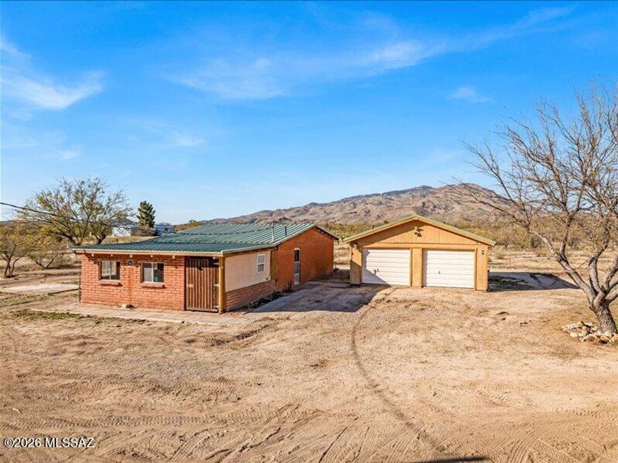 Private desert retreat on 10 expansive acres in the Benson area! Located at 24510 E Marsh Station Rd, this approx. 1,296 sq. ft. single-family home offers 2 bedrooms and 1-1.5 bathrooms in a peaceful rural setting with wide-open space and stunning mountain and desert views.
Ideal for horses, ranch use, or outdoor recreation, the property features natural landscape, dark night skies, and plenty of room for RV parking, trailers, equipment, or future barns and workshops. Detached garage and large outdoor parking area provide added flexibility.
Utilities include electricity, septic system, propane capability, and private well or water haul option. Convenient rural road access with easy reach to the I-10 corridor while enjoying quiet countryside living with minimal traffic. Agent/Owner