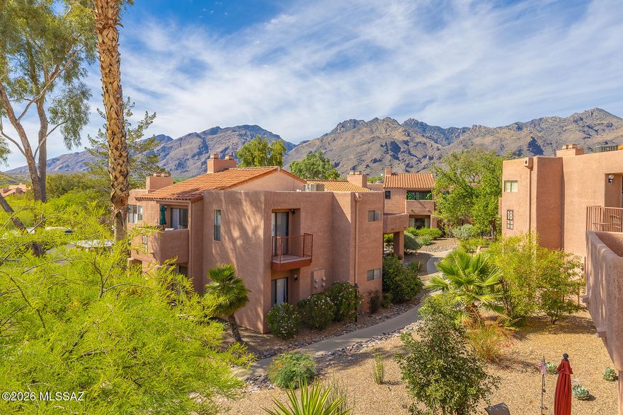 Tucked within the heart of the gated Ventana Vista Condominiums, this beautifully maintained 2-bedroom, 2-bath Sabino Model offers 1164 sq ft of inviting second floor living space. The open-concept great room features a vaulted wood-beamed ceiling and an attractive fireplace, creating a light and airy yet cozy atmosphere. The kitchen provides ample cabinetry and counter space, flowing seamlessly into the dining area, which opens to a balcony- perfect for both indoor and outdoor dining. A split-bedroom floor plan provides privacy and comfort. The spacious primary bedroom features an en-suite bathroom and a private balcony with beautiful mountain views. Zoned heating and cooling add year-round comfort. Convenient laundry closet with full size washer and dryer. This move in ready condo is a perfect blend of comfort and convenience. Condo is being sold turnkey! Updates include new HVAC units that were replaced in 2023, new hot water heaters that were replaced in 2024 and LVP flooring in bedrooms and main areas. Just steps away, enjoy resort style amenities including a heated pool, two spas, pickleball/tennis courts, clubhouse, fitness center, EV chargers, and dog friendly areas. Conveniently located near the Sabino Canyon Recreation Area, a popular destination for walking, hiking, and nature viewing. Close proximity to a variety of shopping and dining options, as well as golf courses and renowned Tucson resorts. Enjoy Tucson living at its finest!