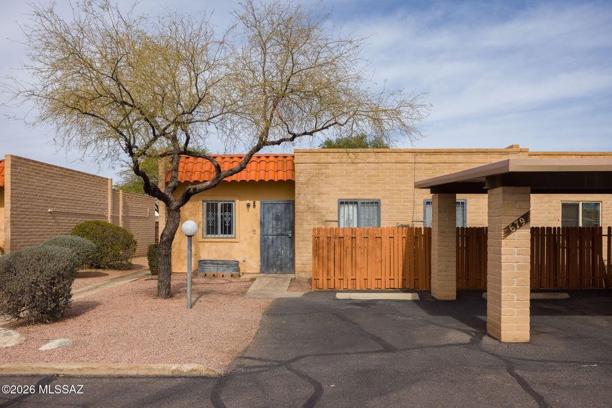 MOVE IN READY! 3 bedroom, 2 bathroom townhouse just steps from the loop for biking or walking is part of the Pantano Wash.  Paved for walking and well maintained dirt path. Offers updated bathrooms, fresh paint, new floors and a newer AC and a new roof. Additional highlights include a private storage shed, community pool, and monthly dues that cover trash service. Conveniently located close to shopping, dining, and more, this charming home is ready for you to move in.