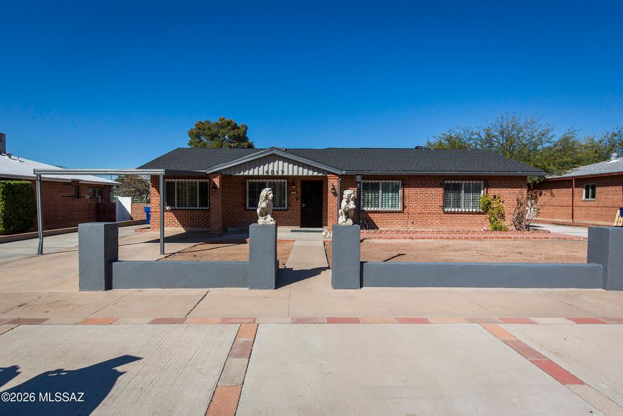 Charming updated Tucson home with paid-off solar, No HOA and major improvements completed within the last 2 years, including roof, metal siding, exterior paint, and pool filter system. Large workshop w/cooling and 220 electrical and insulated storage shed w/power. The Home features RV parking, carport plus side parking, and two gated backyard entrances. Enjoy a beautiful, covered patio with fans and lighting, cool decking, gas grill line, and mature fruit trees. Interior offers fresh paint, tile flooring throughout, plantation shutters, ceiling fans, gas fireplace, bonus/flex room with built-ins, 3 skylights (kitchen opens with rain sensor), pull-out shelving, oversized laundry, lots of storage and conveniently located to shopping, dining, entertainment and lots of amenities. A Must See!