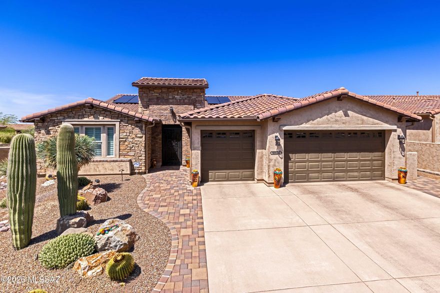 Extended primary suite & 3-car garage on a premium arroyo lot! SE-facing Vienta with sunset & mountain views, beautifully landscaped & fully fenced yard -- snake fence for peace of mind. Paver patio with wall-mounted fireplace & electric shades. Inside: tray ceilings, tall doors, custom glass front & iron security doors, plantation shutters & top-down/top-up blinds, LVP & carpet, ceiling speakers throughout. Chef's kitchen w/2-yr-old high-end induction appliances, reverse osmosis & under-cabinet lighting. Whole-house air purifier, owned water softener, owned solar, security system & keyless entry. Epoxy garage floor w/built-in cabinets. Meticulously maintained & move-in ready -- enjoy SaddleBrooke Ranch resort living!
