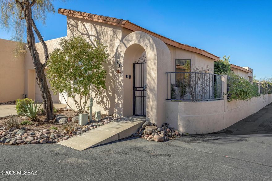 Welcome to effortless living in the Catalina Foothills! This 2BR+Large Den patio home is nestled within the popular gated community of Kachina Hills. A split bedroom plan offers the perfect blend of privacy and luxury.
The heart of the home features a bright and airy kitchen with a charming breakfast area, where you can enjoy your morning coffee while taking in the Catalina mountain view. The spacious living and dining areas provide an elegant setting for entertaining, while the large den complete with a double pocket door offers the versatility for a home office, media room, or hobby space. The thoughtful layout ensures maximum privacy for the primary suite and the secondary bedroom. Step outside to your private back patio to soak in the serene desert landscape & mountain views. With its low-maintenance lifestyle and secure gated setting, this home is a rare find. Enjoy the community pool, spa, and two gates for easy access to Swan Road and Pontatoc Road. The primary bathroom has been updated with modern finishes, a tiled shower, dual vanities, and a walk-in second closet. The washer, dryer, refrigerator, and all concrete planters are included in the sale. Some items that remain in the home can be included in the sale (original artwork in the dining room and above the fireplace, and some staging items are not included in the sale).
