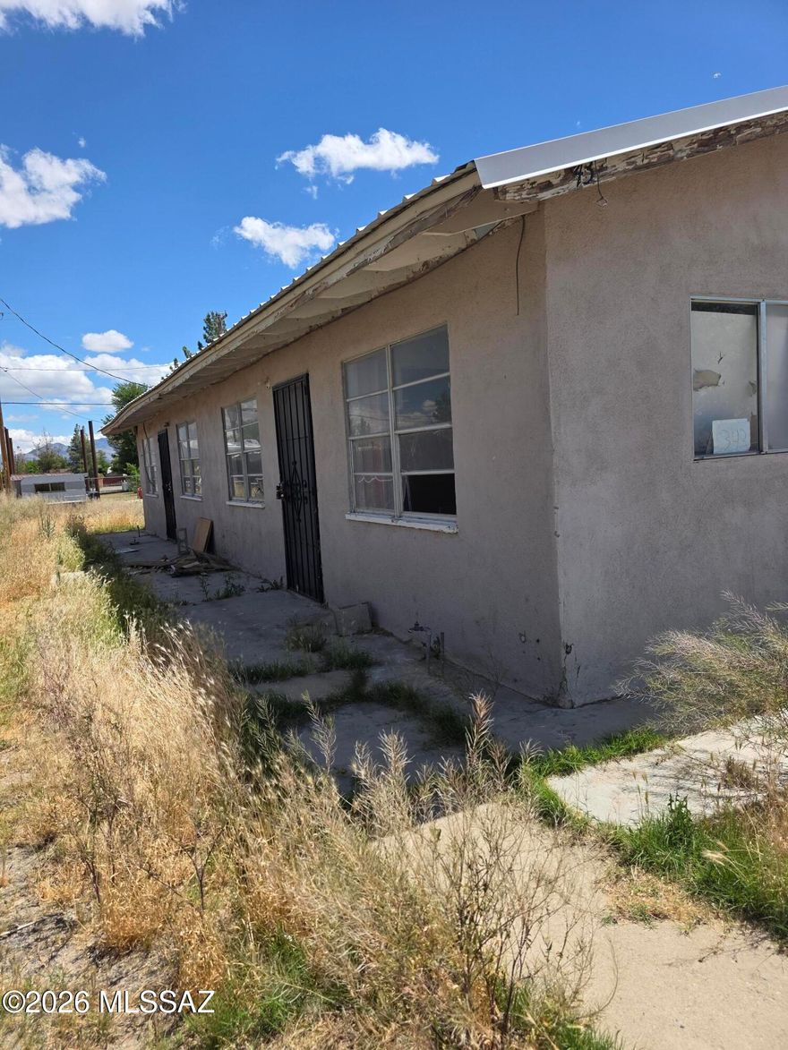 Duplex partially finished and in need of repairs. Currently vacant. Close to schools and shopping. Potential for extra income.