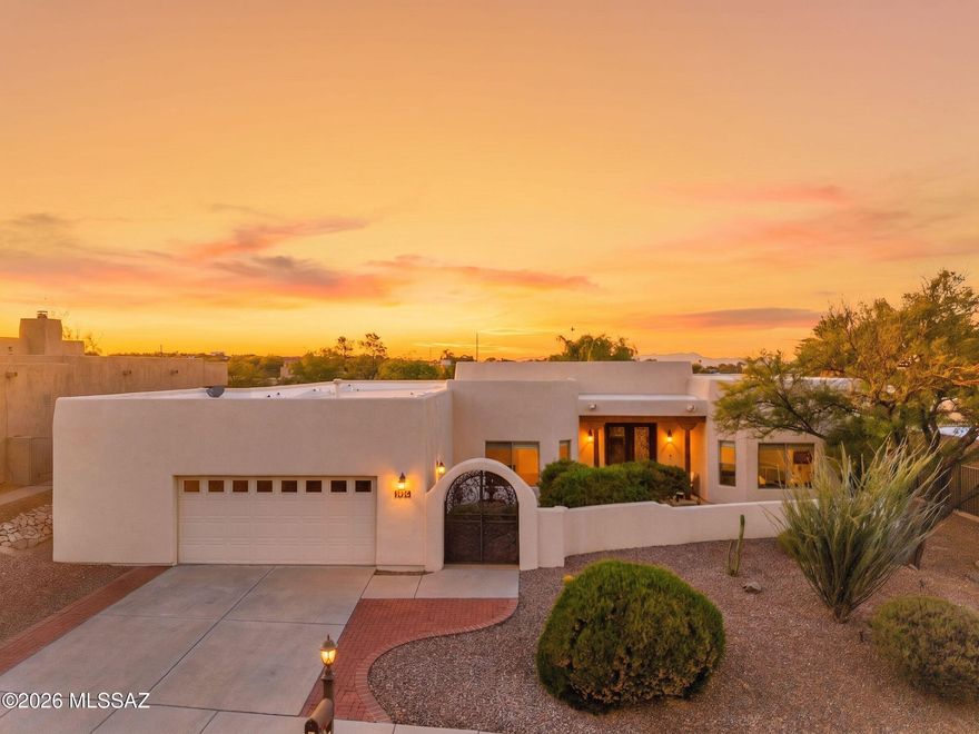 Luxury desert living in the Tucson Mountains with Catalina views and stunning upgrades throughout. Enter through a tranquil courtyard into a light filled home with soaring ceilings, four spacious bedrooms, and beautifully remodeled baths. The custom chef's kitchen features marble countertops, extensive cabinetry, oversized double ovens, stainless farmhouse sink, and a dramatic marble island with seating for four. New rear doors and windows enhance the indoor/outdoor connection and frame the resort style backyard with pool, spa, and multiple entertaining spaces. Enjoy Tucson's renowned dark skies and mountain views from your private oasis. Additional updates include newer HVAC systems, water heaters, pool equipment, and more. See the upgrade list in Documents.