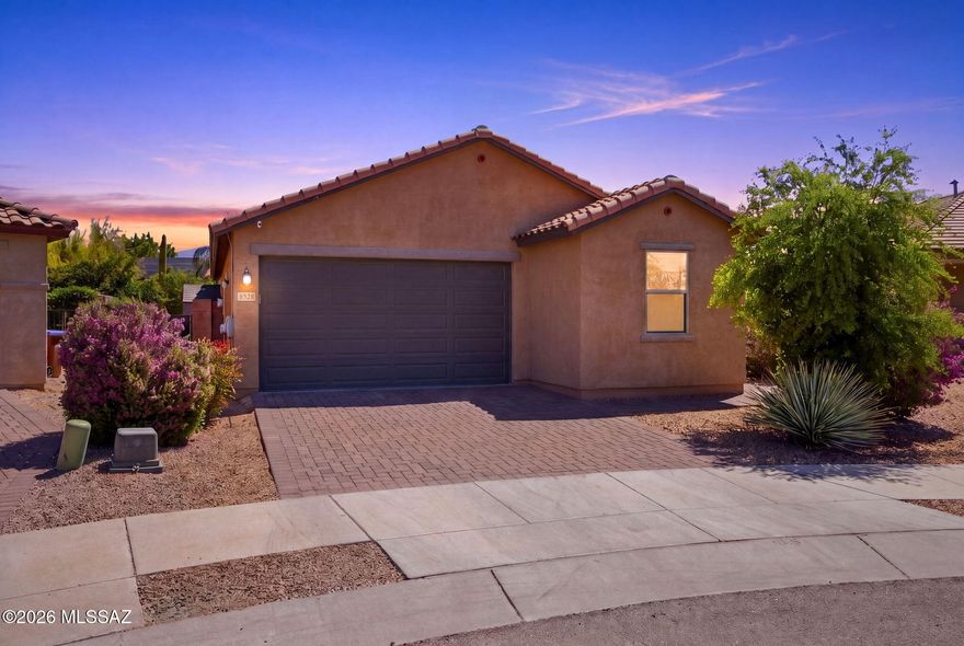 VA ASSUMABLE LOAN AT 2.25%*! Rare rate opportunity for HUGE SAVINGS! This 3 BED + DEN, 2 BATH Northwest Tucson home also features OWNED SOLAR for major energy savings (loan paid off at COE with acceptable offer). 1,861 sq ft of modern living with an open-concept layout, neutral tones, and contemporary finishes. Kitchen shines with granite counters, stainless appliances, and a spacious island. Primary suite offers a walk-in closet and dual-sink ensuite. Versatile den works as office, gym, or playroom. Oversized lot with spacious backyard backing to common area for space and privacy. 2-car garage, near shopping, dining, and major roadways. This home is ready for you! (*Buyer must qualify for loan assumption)